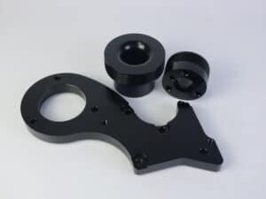 Precision black automotive performance pulley kit for optimal engine efficiency.