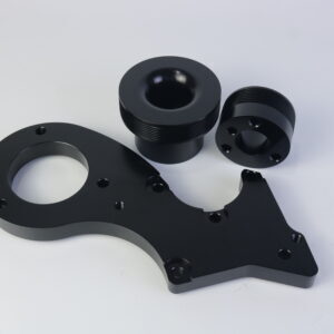 Precision black automotive performance pulley kit for optimal engine efficiency.